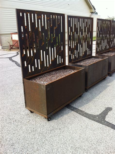 steel planting boxes on site walls|nice planter boxes.